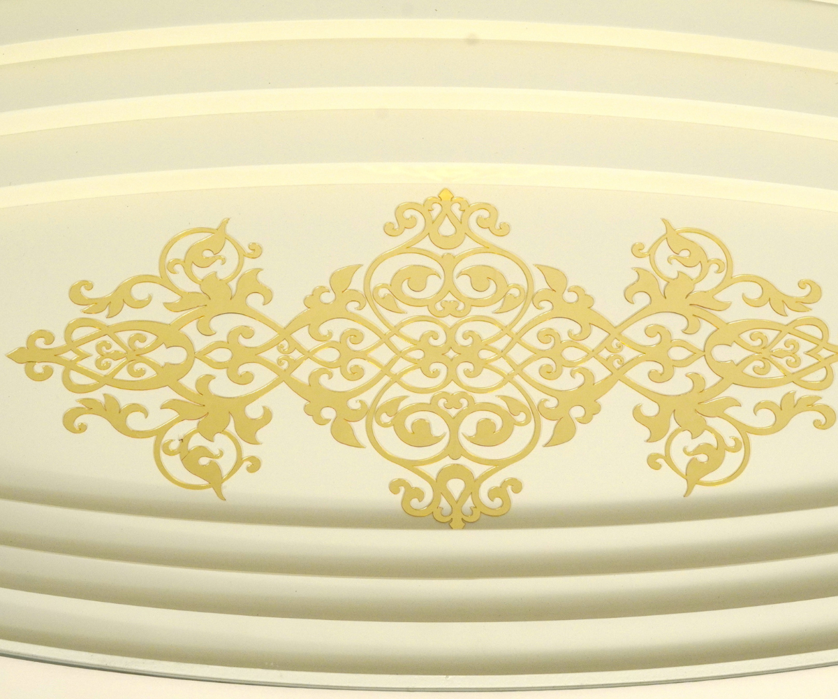 010 cream oval scalloped table in a warm-lit marble living room