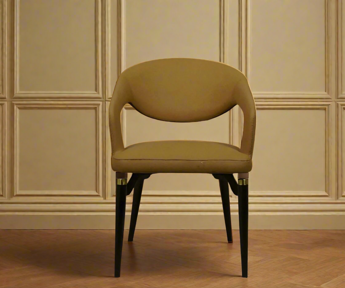032 leather sculptural accent chair, front view against a panelled wall