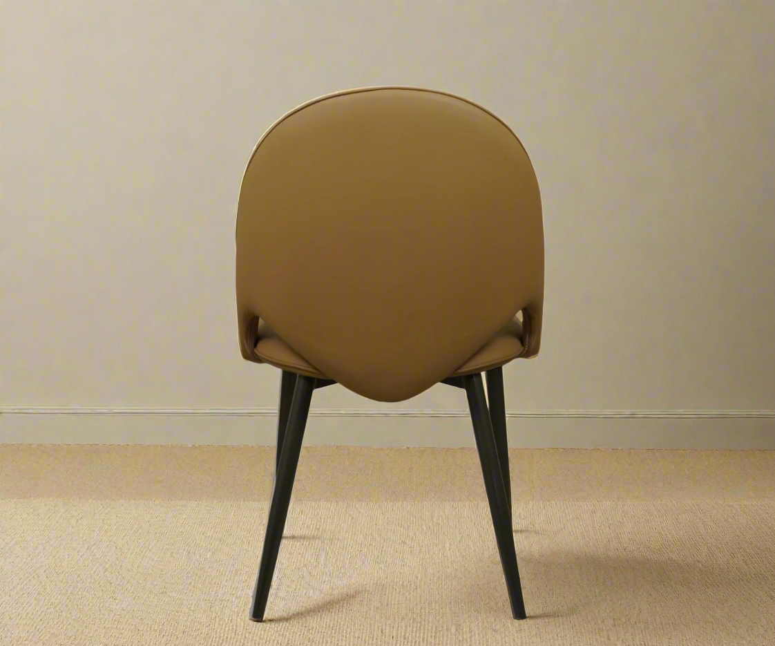 065 ochre minimalist silhouette chair, angled view in raking light