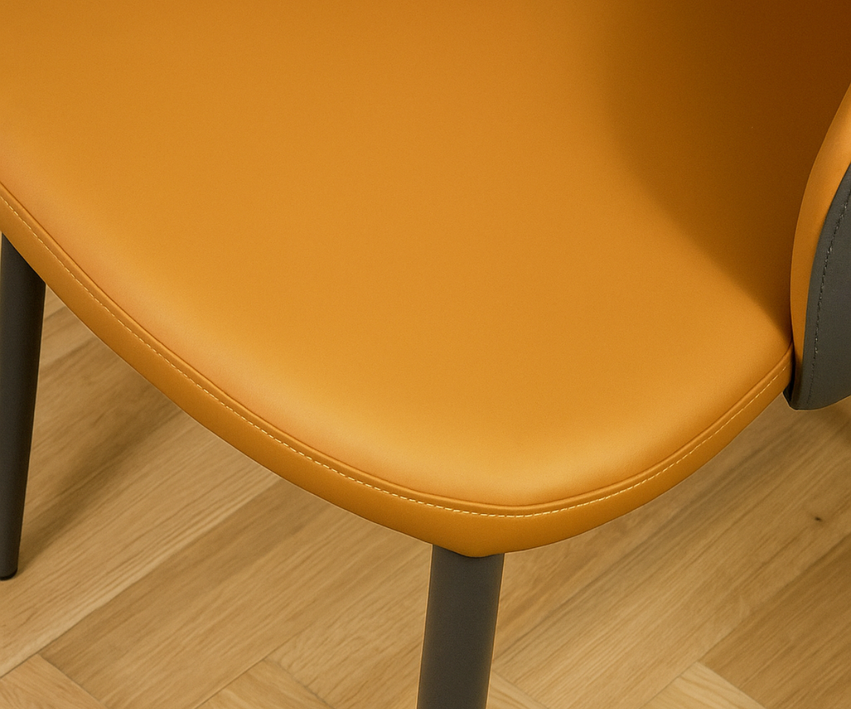 082 two-tone mustard and grey designer chair, angled view on a wood floor