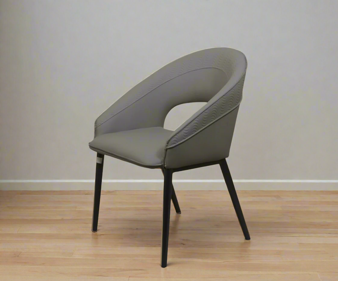 095 mid-century dining chair in grey, angled view on a wood floor