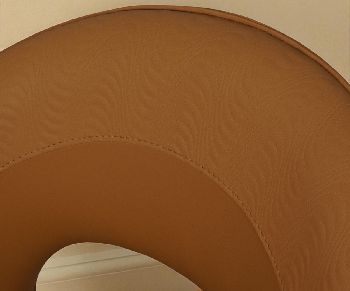 095 tan leather silhouette chair, angled view against a wood-panelled wall