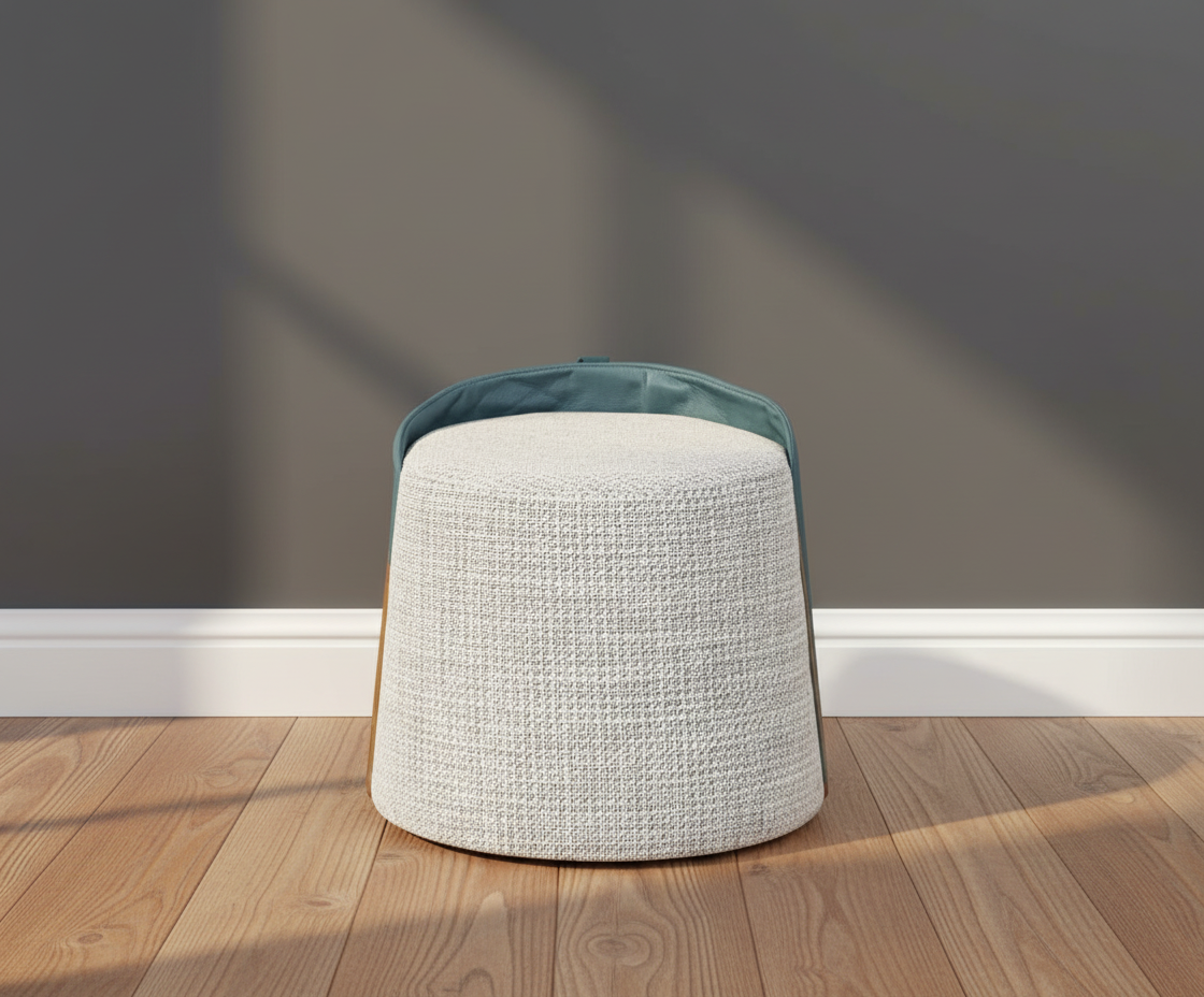 118 sculpted round ottoman, front view with a woven body and teal top