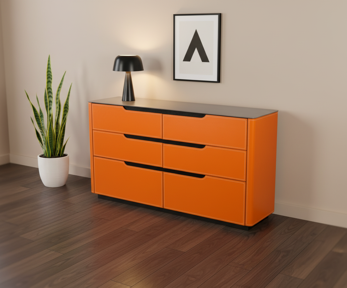 2002 orange drawer cabinet beside a plant in a bright room
