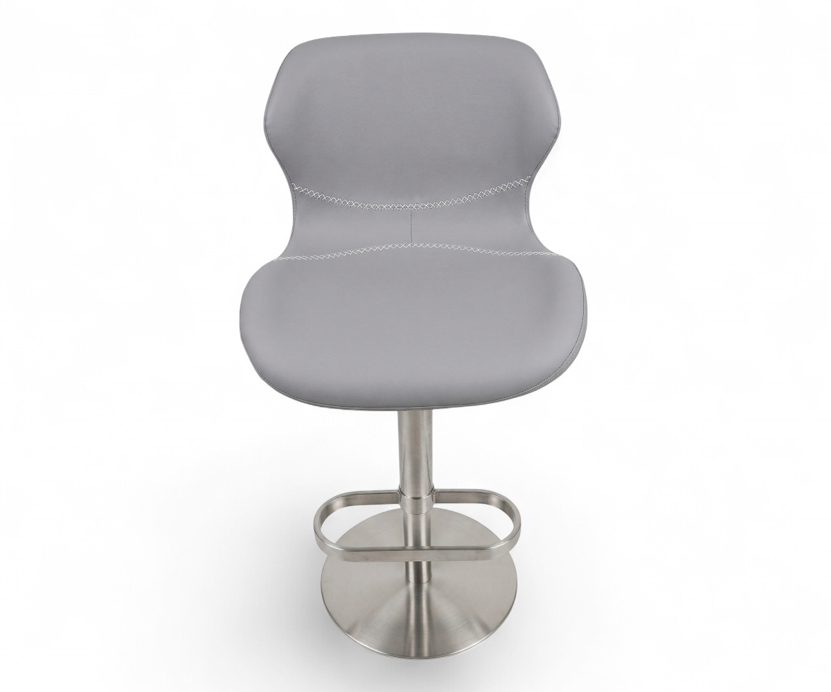 2406 bar chair at a lit marble bar counter in a hotel lounge