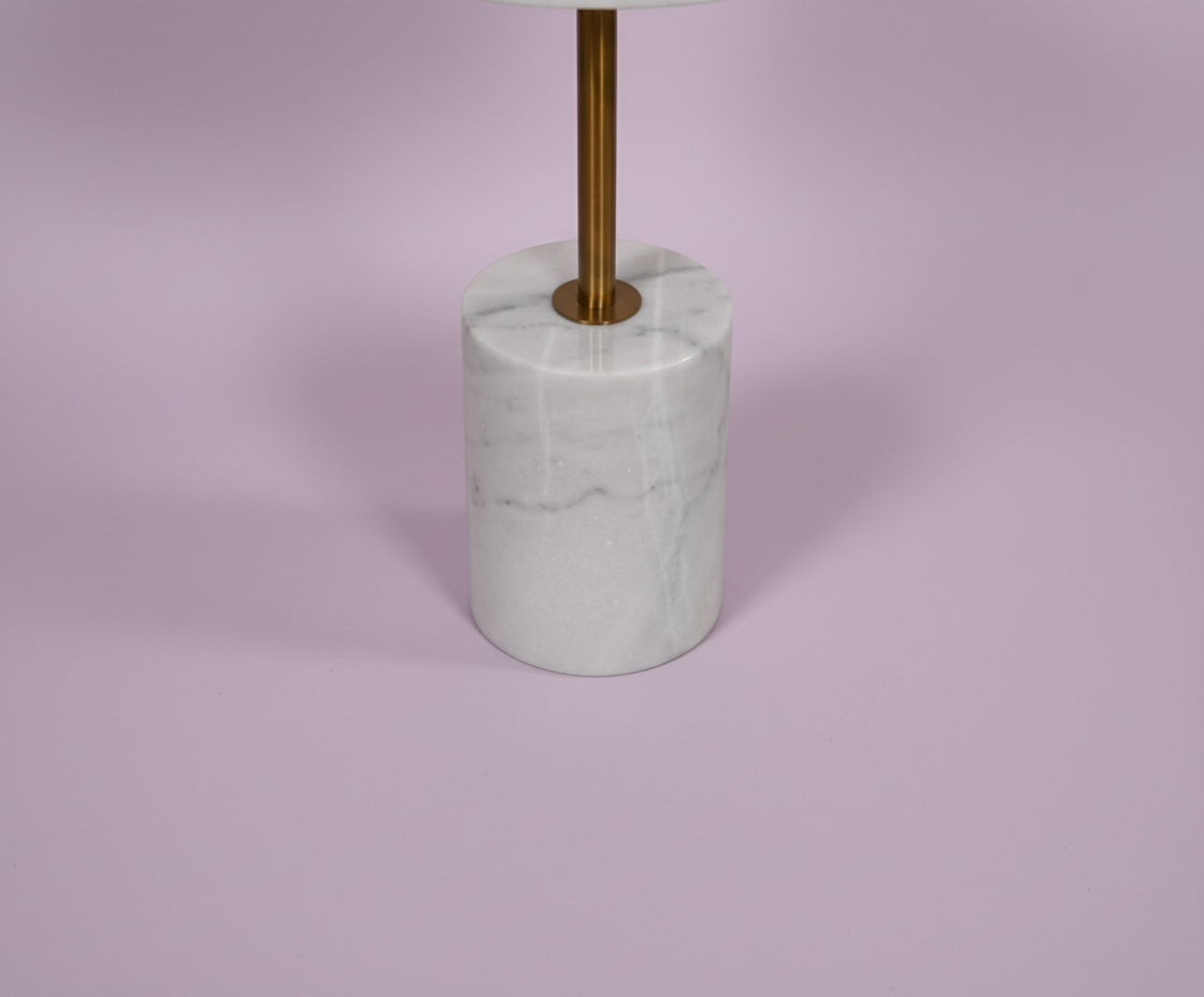 499# white terrazzo table, front view with a speckled top on a marble cylinder