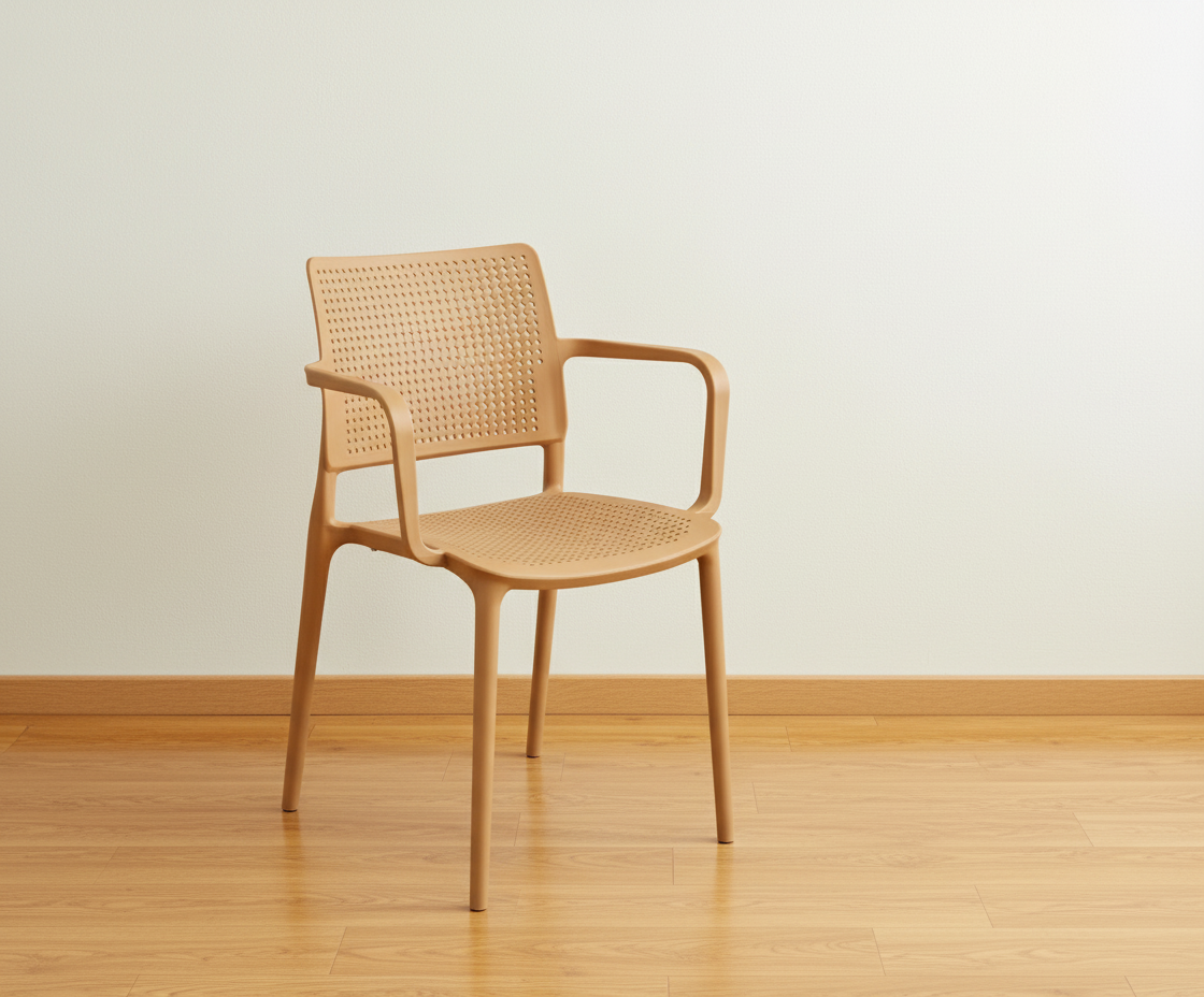 8339A perforated outdoor armchair in beige, angled view on a wood floor