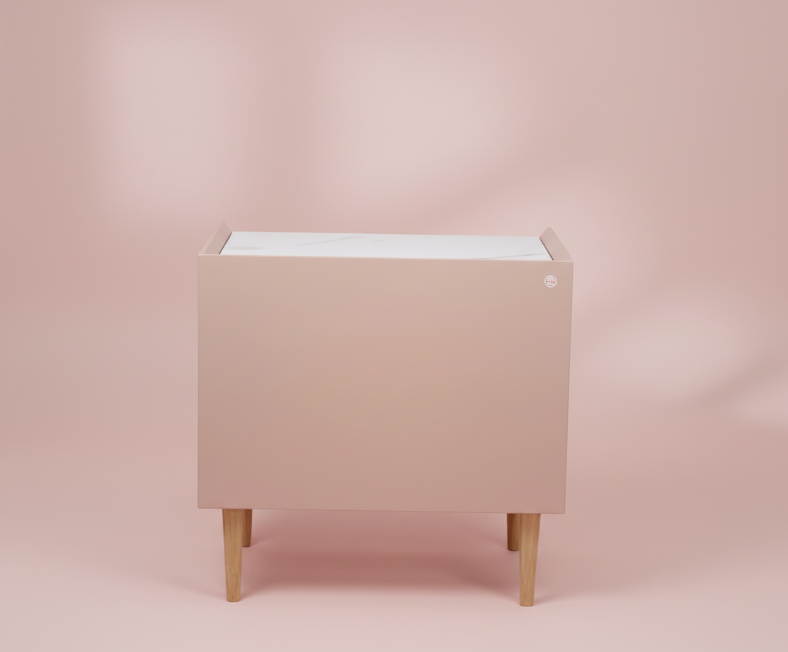 887 blush pink nightstand, front view with a marble top and brass pulls
