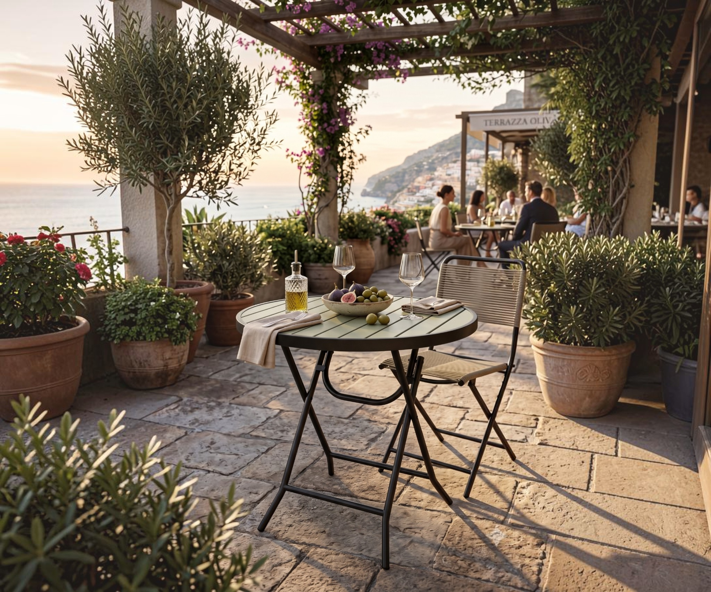 928 garden table, round folding table on a Mediterranean garden terrace
