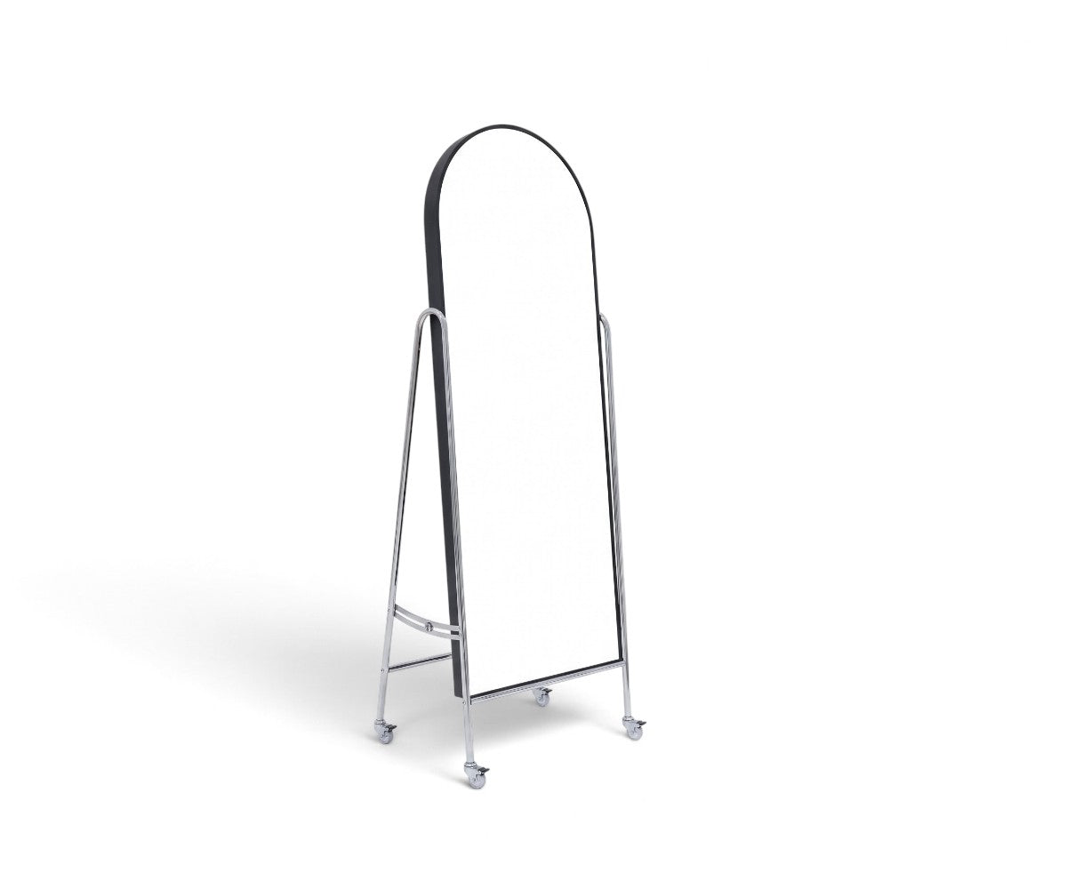 Arched floor mirror with matte black frame on polished chrome rolling stand
