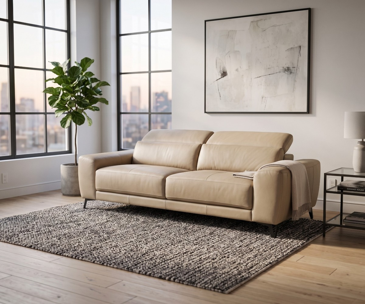 Beige leather three-seater sofa with adjustable ratchet headrests and dark metal legs