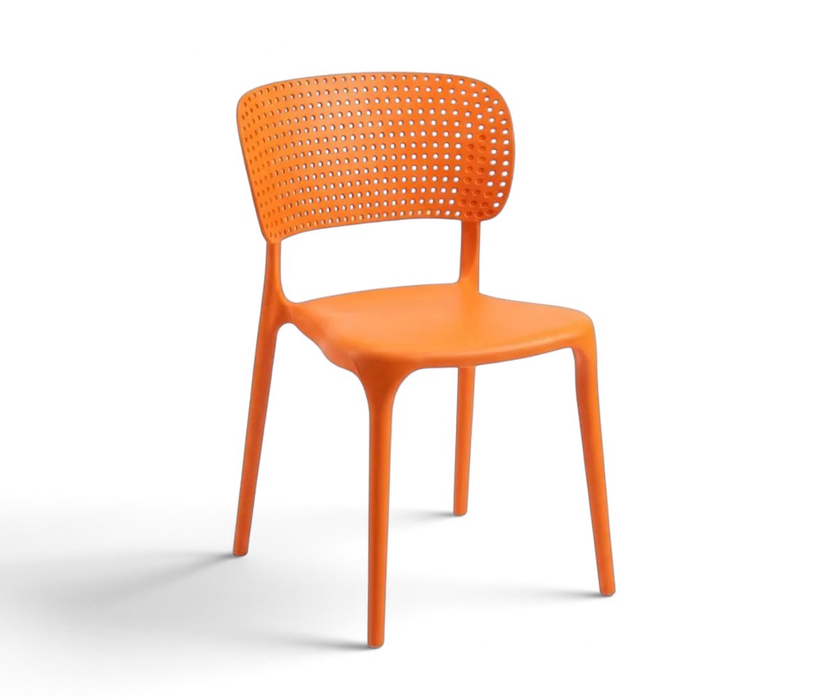 Orange armless dining chair with a curved perforated backrest and four tapered legs.