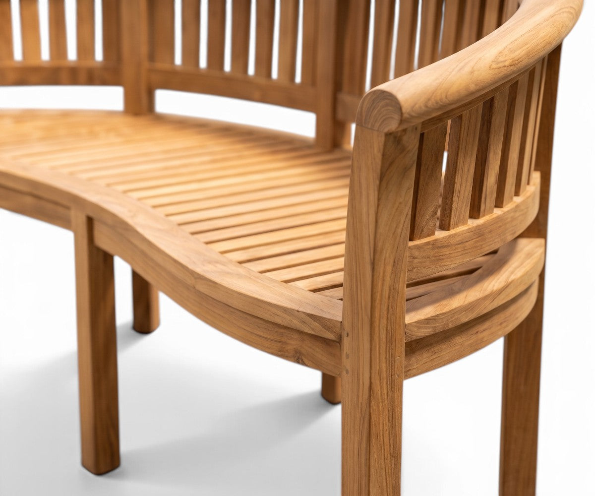 Curved wooden outdoor bench with slatted seat and backrest