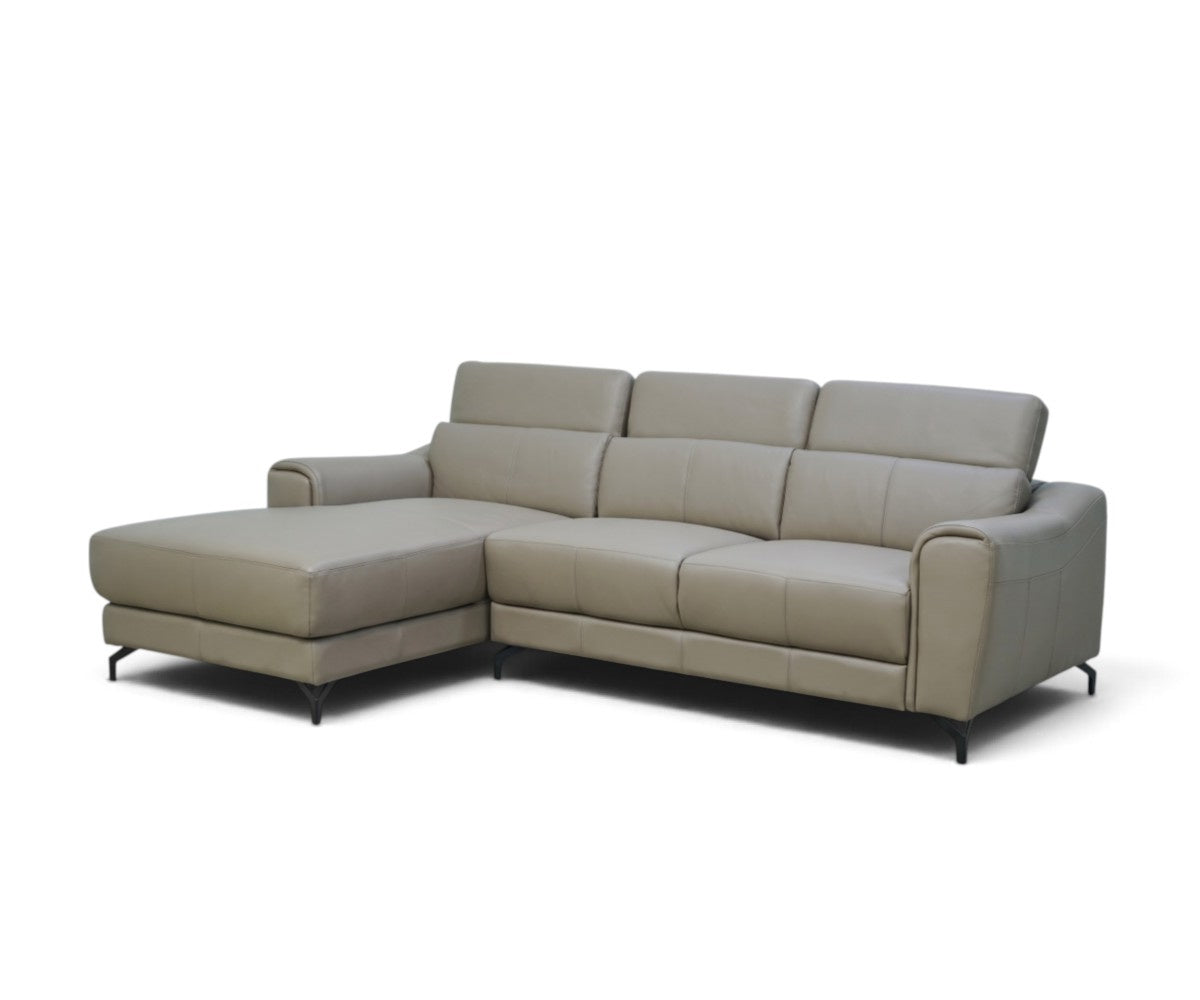Grey leather corner sofa with chaise on the left and sloped padded armrests