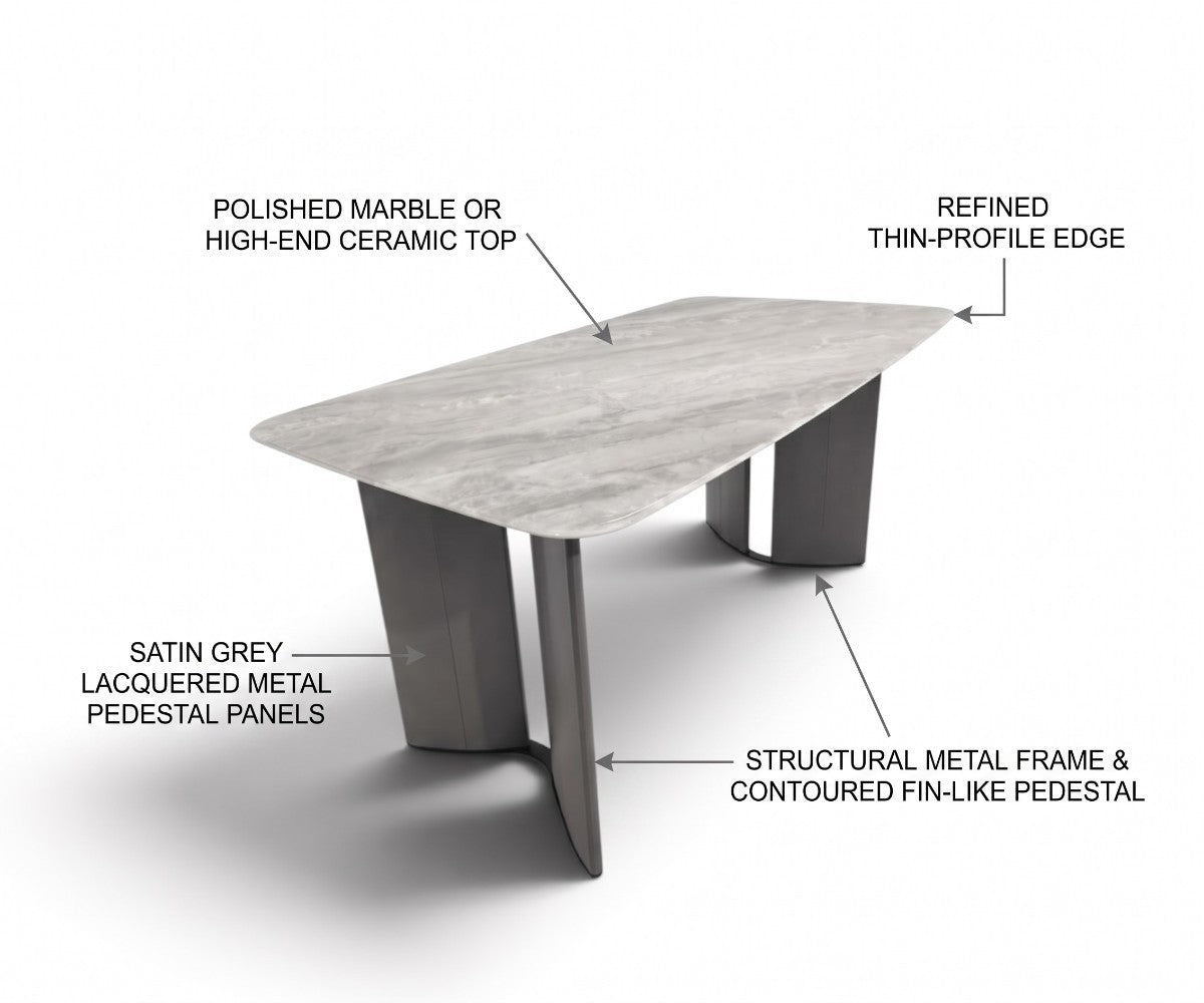Grey stone-top dining table with twin sculptural satin metal pedestals