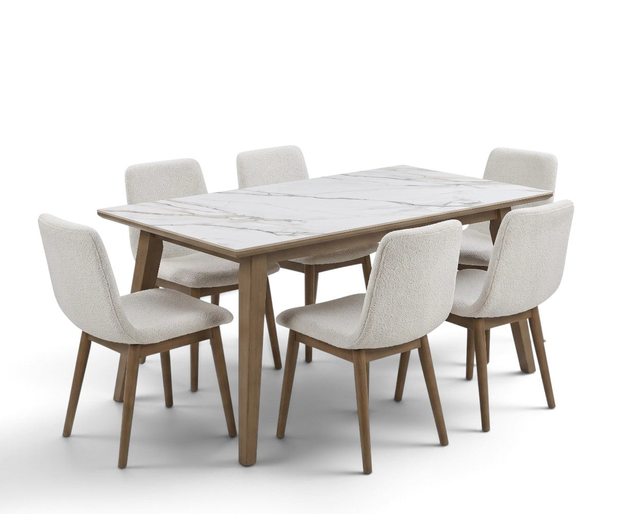 White marble-effect rectangular dining table with six cream upholstered chairs and wood-tone legs.