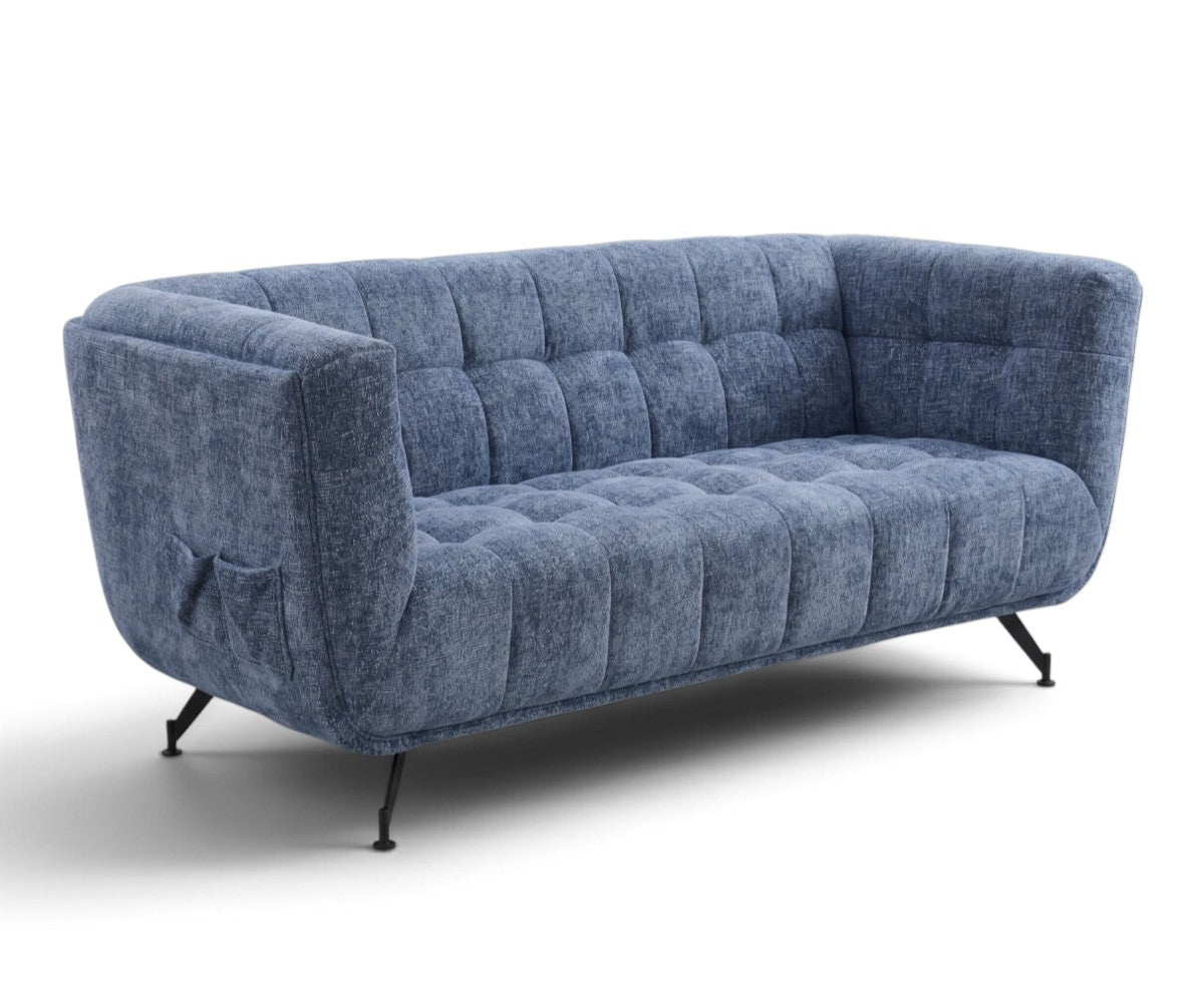 Mid-century style blue tufted two-seater sofa viewed from an angle