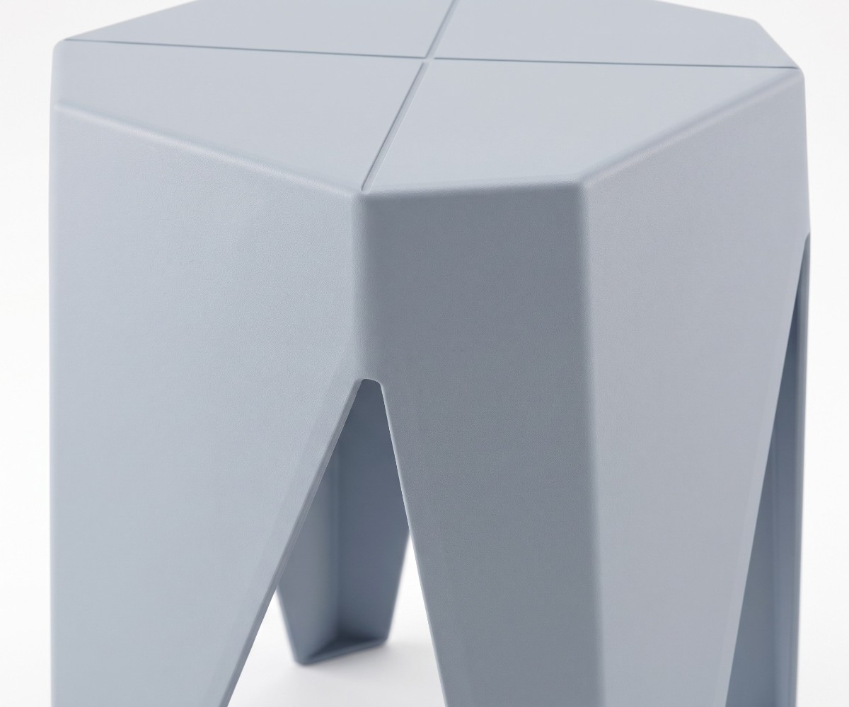 Modern geometric grey stool with faceted seat and angular four-leg design