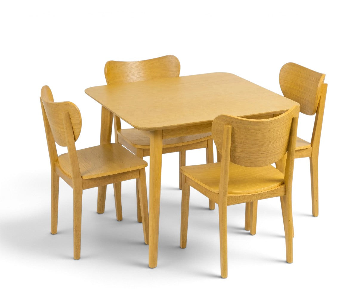 Honey-toned dining table with rounded corners and four matching wooden-look chairs.