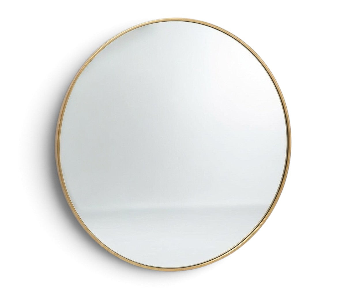 Round wall mirror with slim brass-finished metal frame and clear glass