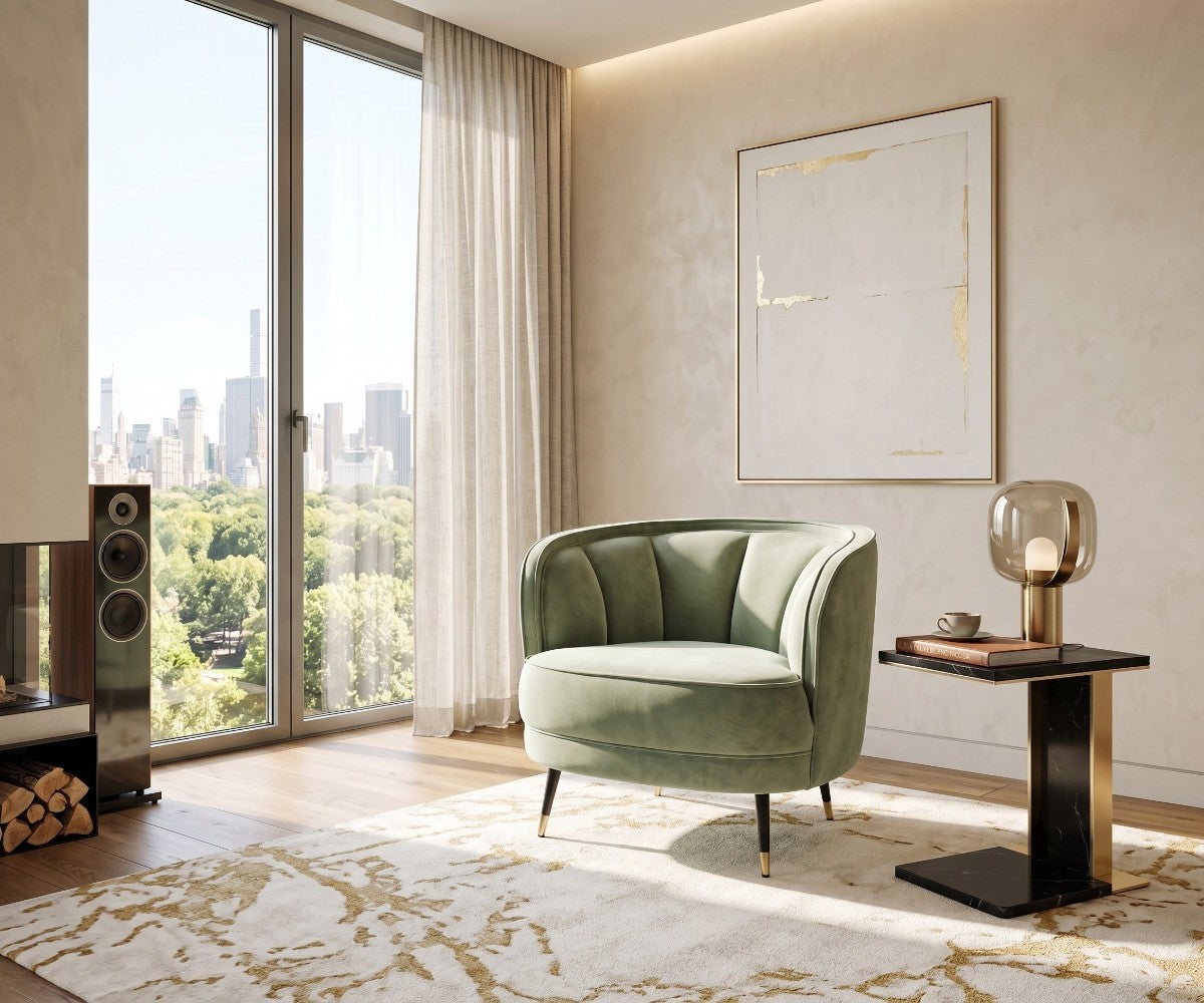Sage green velvet accent chair with channel tufted barrel back and gold-tipped legs