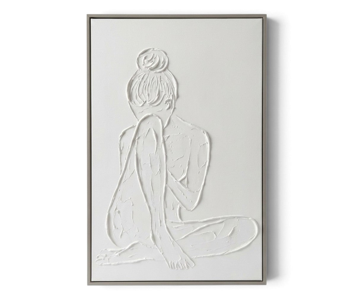White textured wall art depicting a seated woman inside a slim grey-brown rectangular frame.