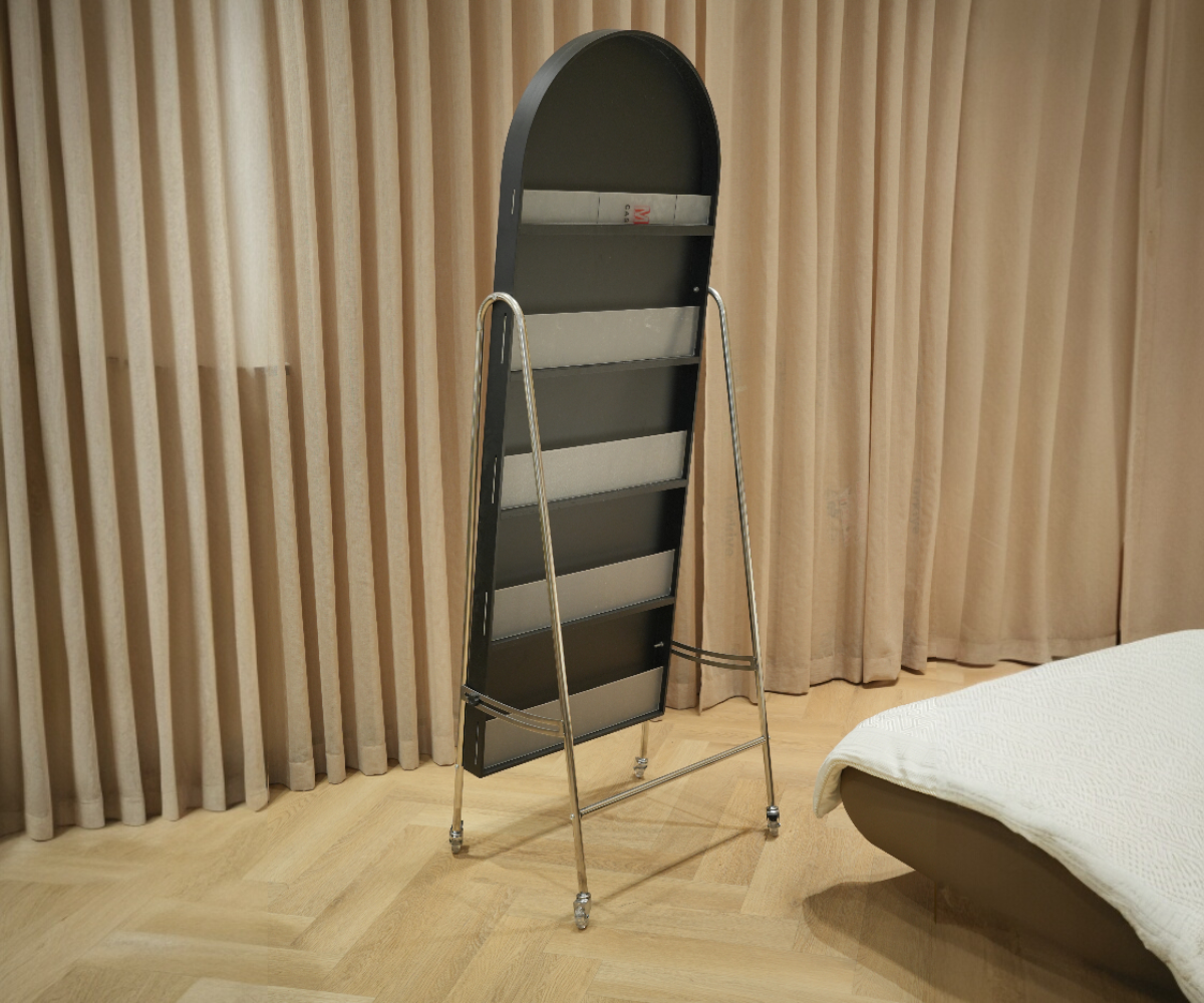 A-1 storage standing mirror in a curtained bedroom beside a chaise