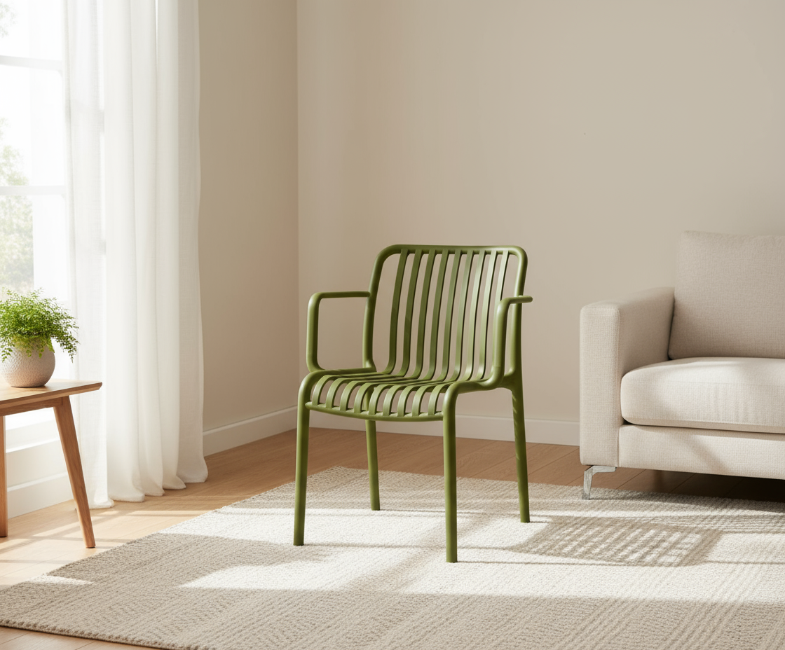 A654 moss green architectural outdoor chair in a bright room beside a sofa