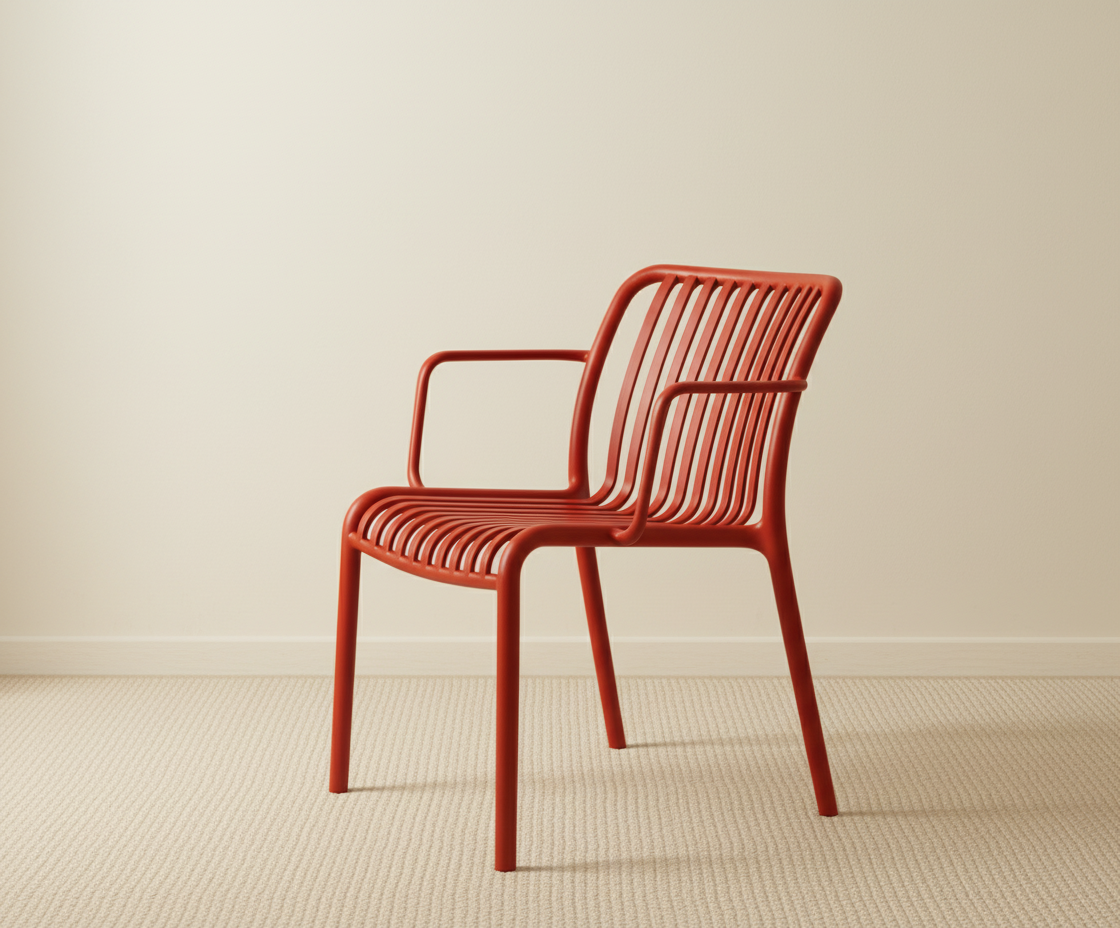 A654 sunset ribbed designer patio chair in rust, angled view in a bright room