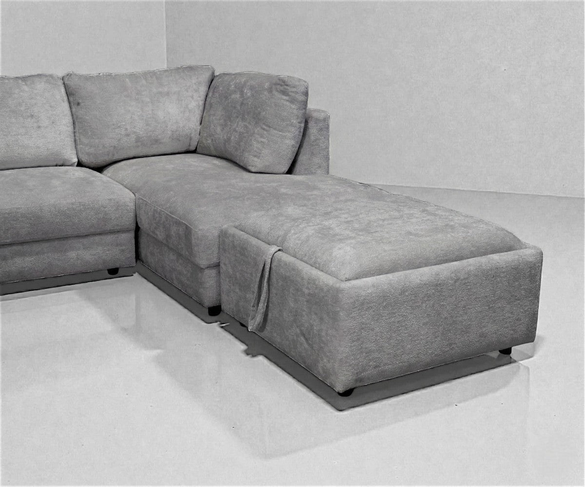 AMELIA grey modular sectional in a bright city-view living room