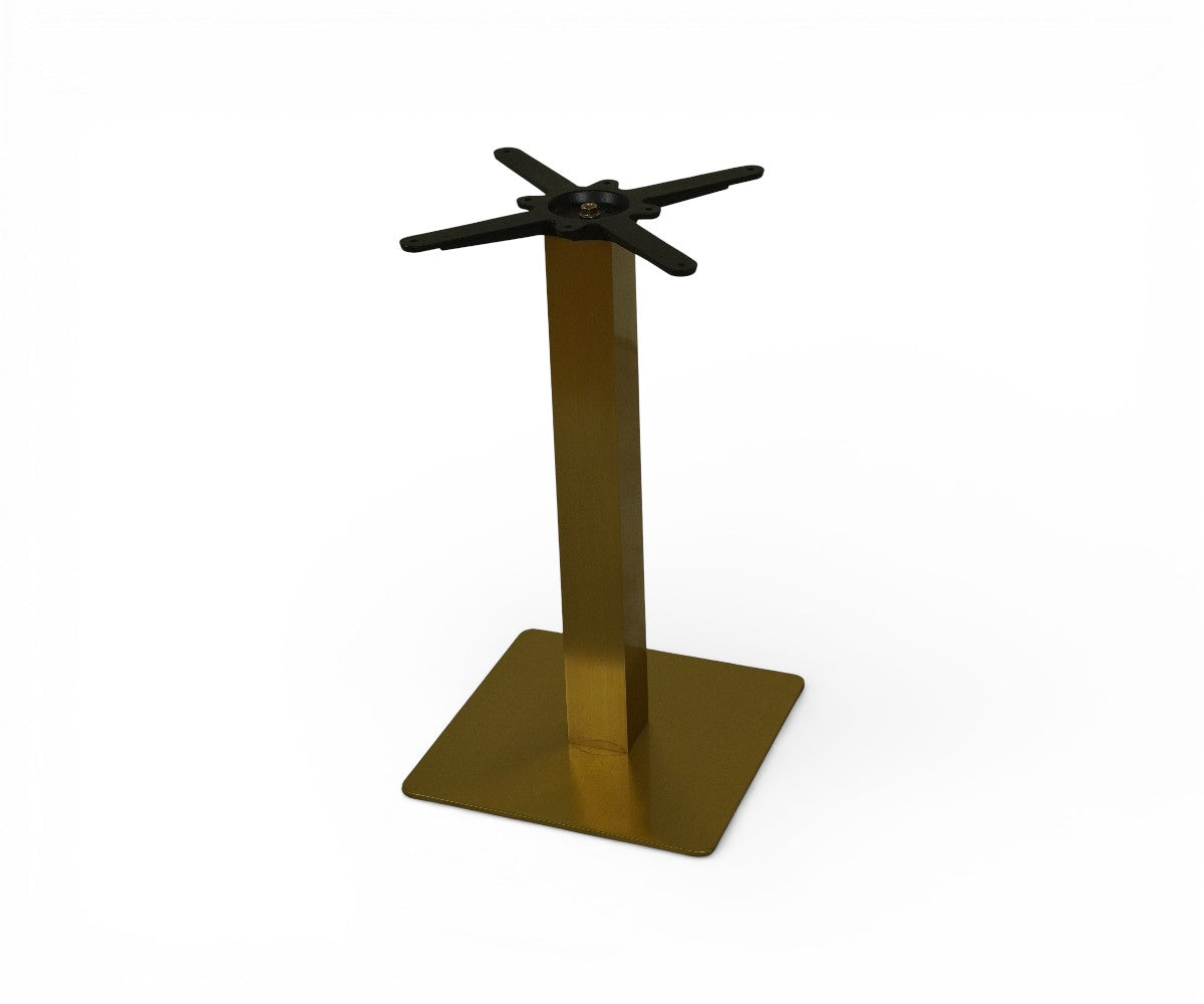 AURUM brushed gold square table base under a walnut table in a restaurant