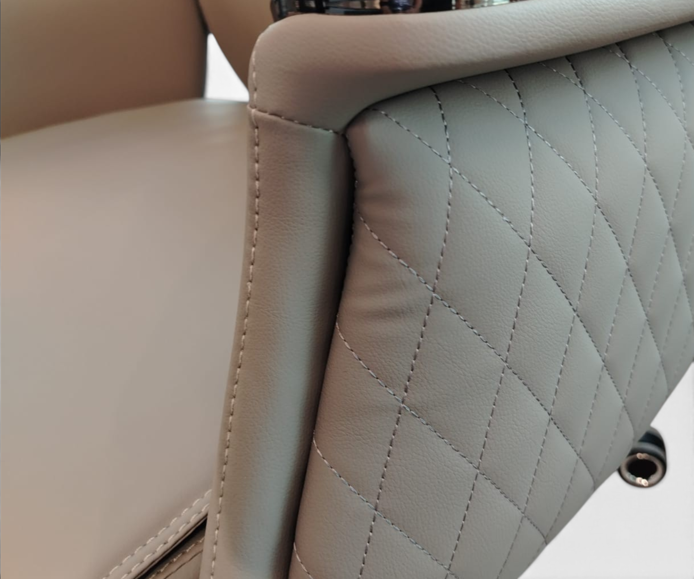 B859 grey lowback chair behind a walnut desk with a night city view