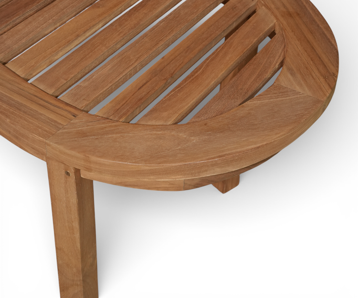 BANANA curved backless wooden bench, beside a poolside sofa under a pergola