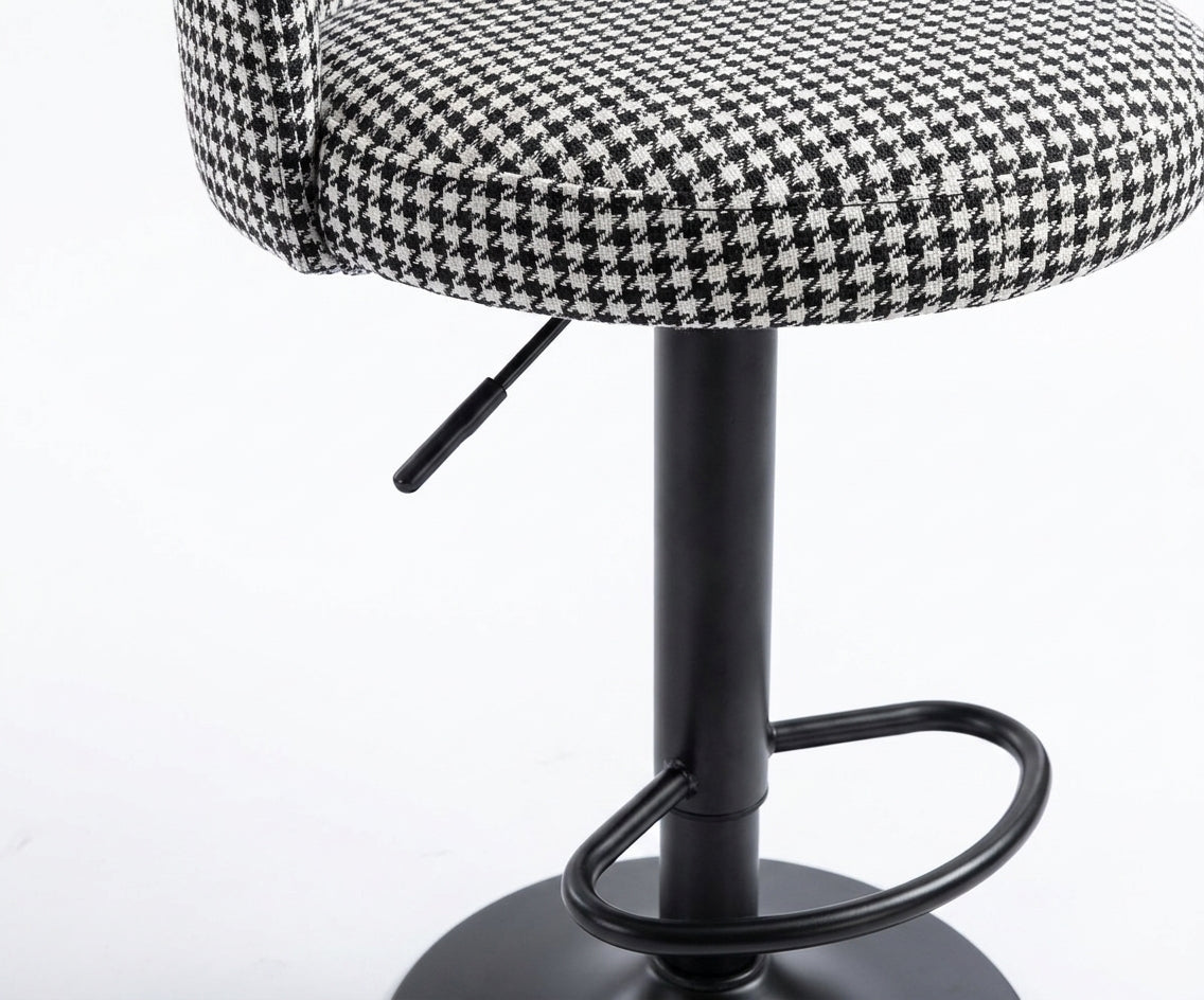 BAR CHAIR .H-9018 at a black marble bar with a city skyline behind