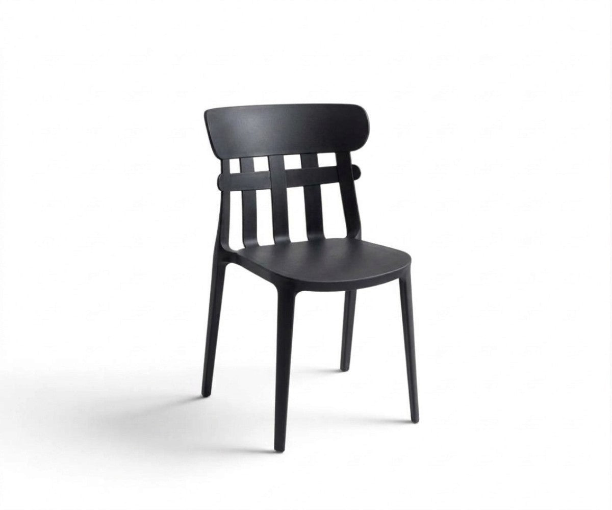 Black slat-back dining chair with curved top rail styled in a modern luxury dining room