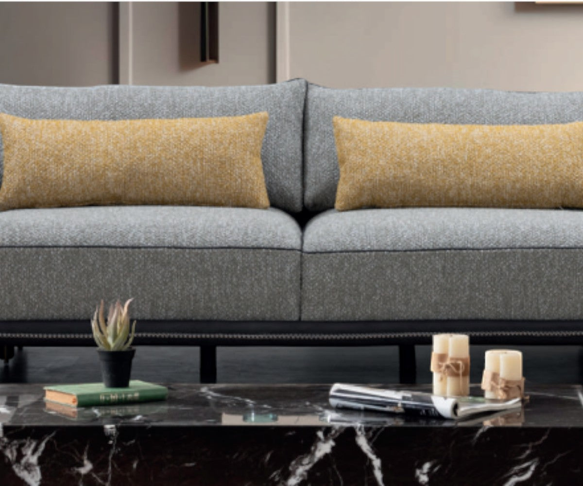 BROSS grey luxury sofa set in a bright city-view living room