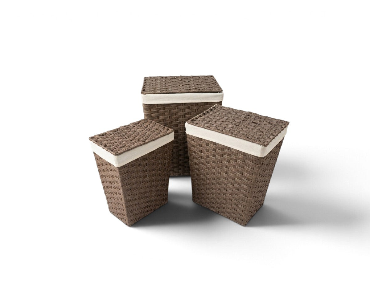 Brown three-piece laundry bag set with lids and cream lining styled in a luxurious, well-lit modern dressing room