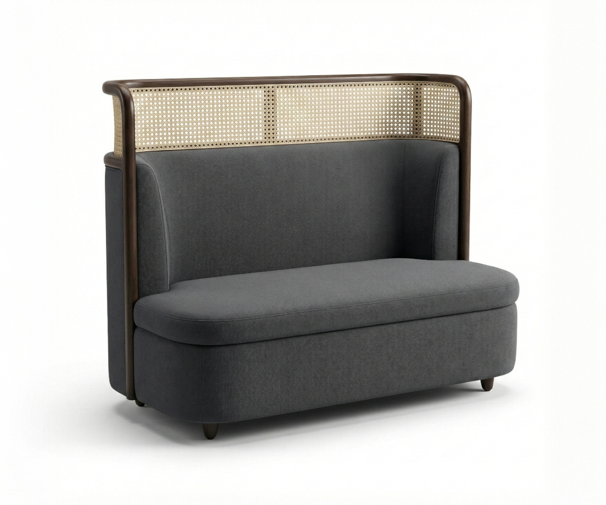 Cane cocoon loveseat in a warm-lit restaurant beside a marble bistro table