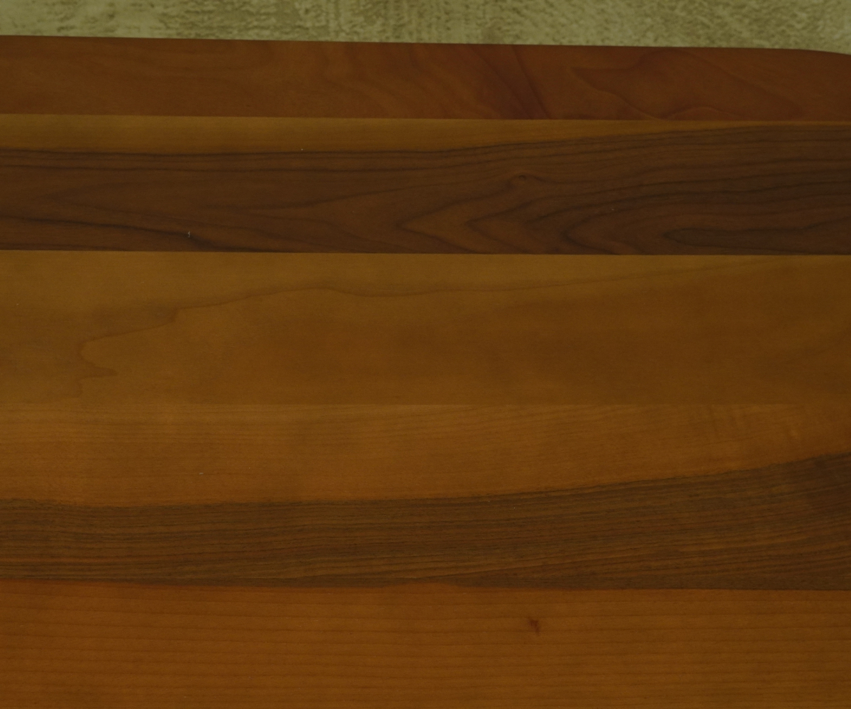 Carmen Orta walnut oval table in a bright panelled living room