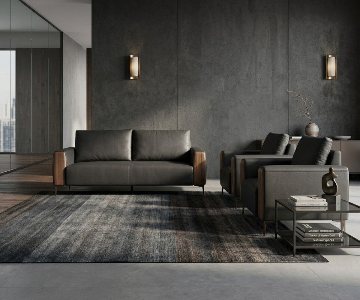 Charcoal and brown three-piece sofa set with two matching armchairs in a luxurious, well-lit modern living room