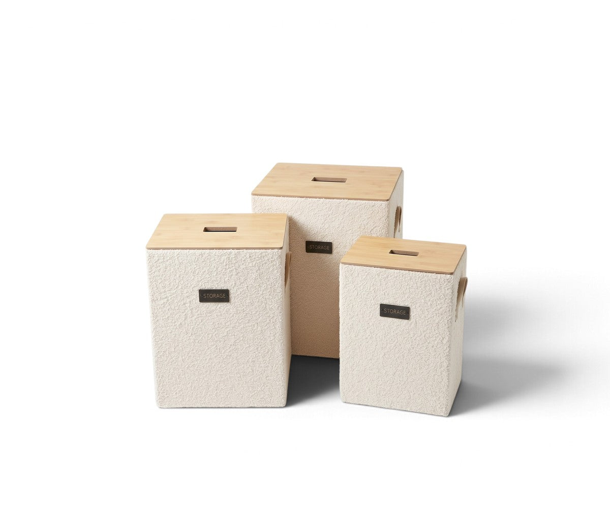 Cream three-piece storage basket set with light natural-tone lids styled in a luxurious, well-lit modern dressing room