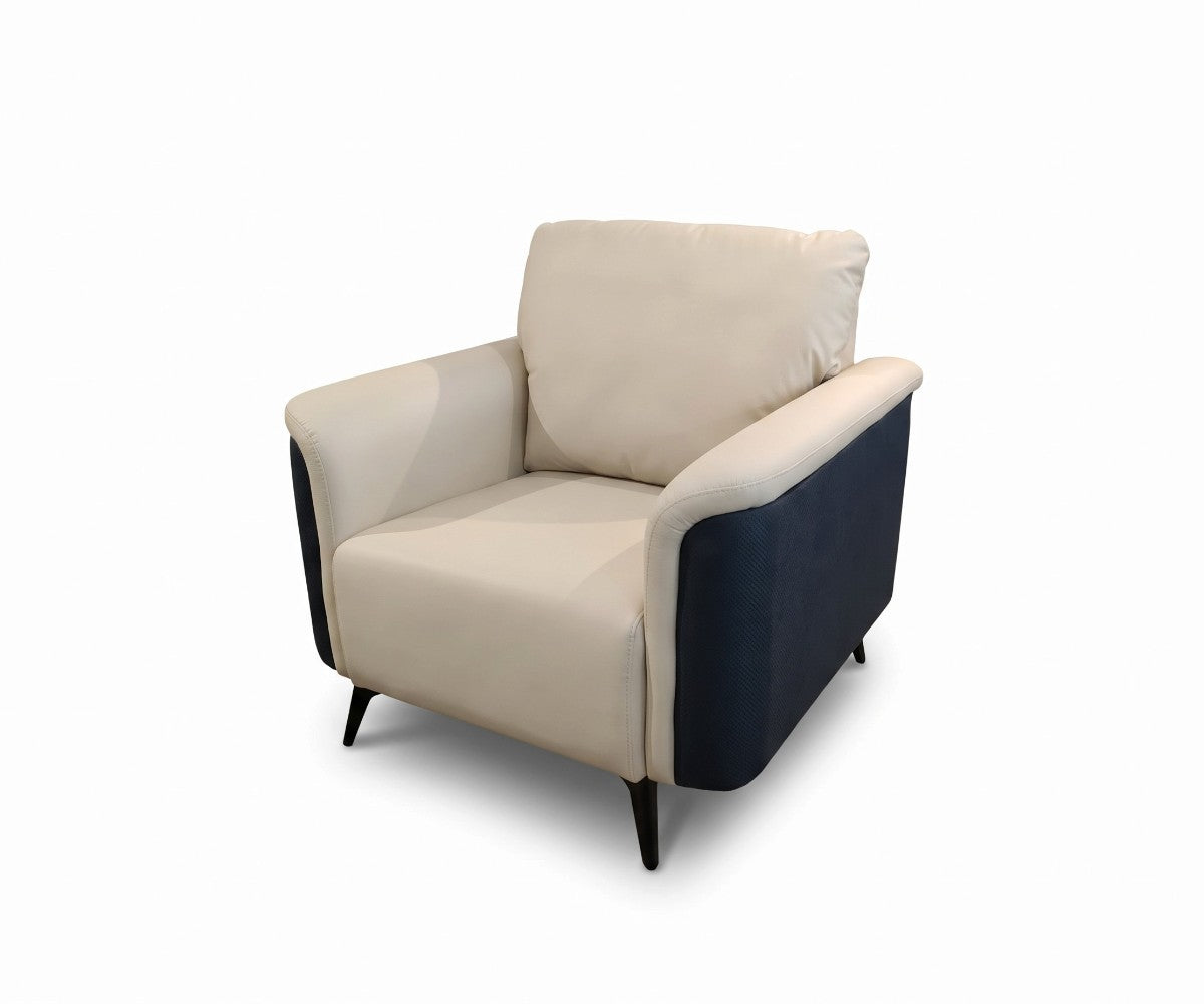 Cream and navy three-piece sofa set with two matching armchairs in a luxurious, well-lit modern living room