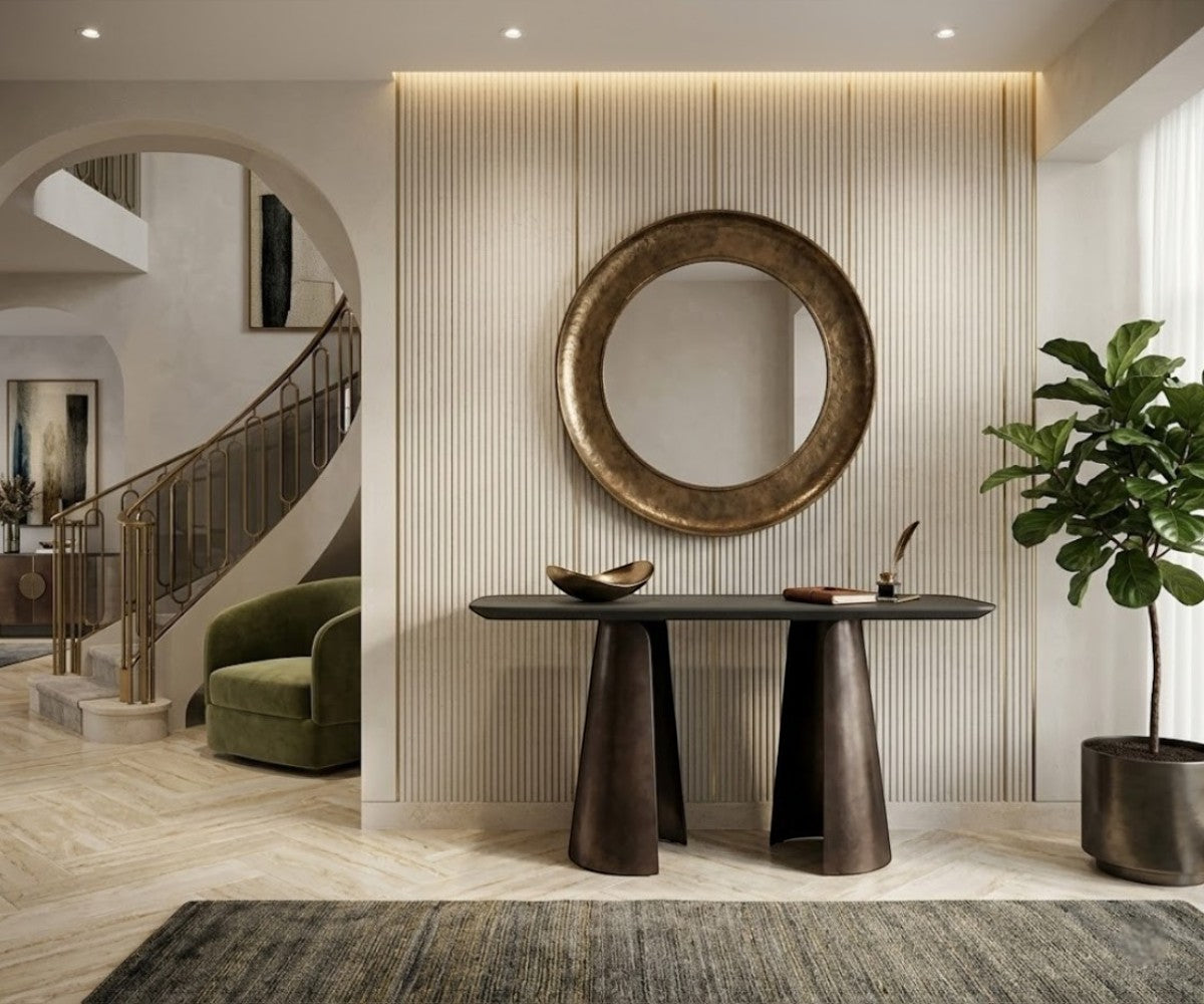 CS22 black top console beneath a round gold mirror in a bright hallway