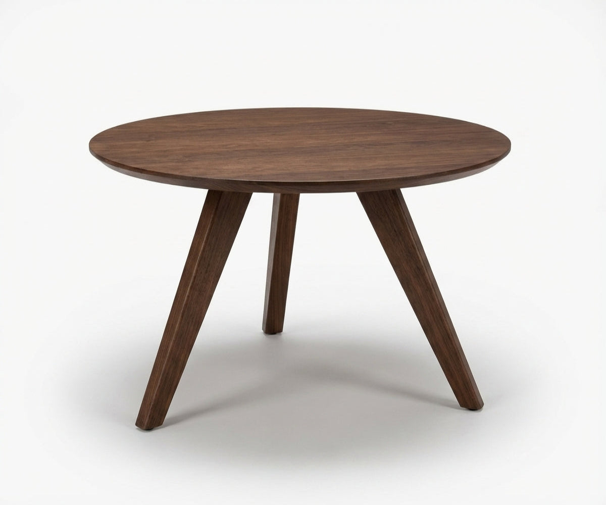 CT-81 round walnut table in a bright room with a marble fireplace