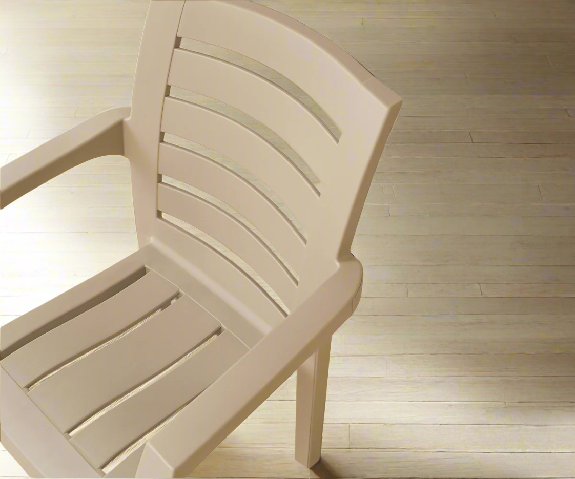 CT012 HANIMELI slat-back plastic armchair, angled view on a wood floor