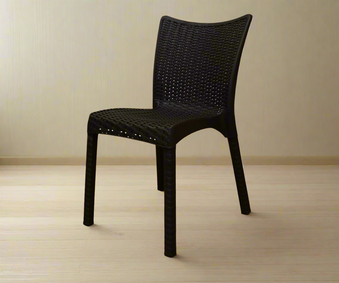 CT020 NERGISI woven minimalist chair in black, angled view on a wood floor