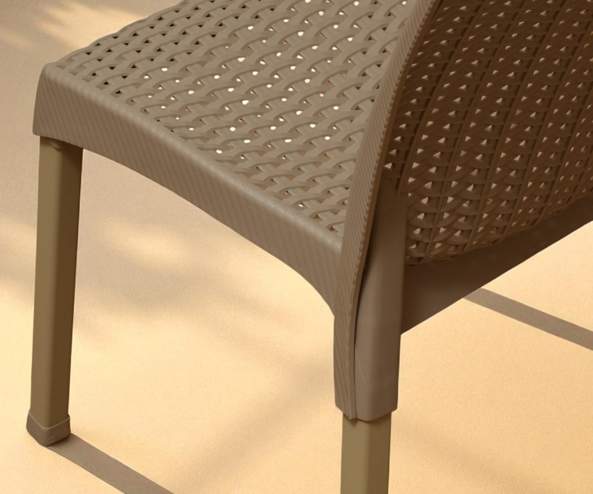 CT021 contemporary woven resin chair, angled view against a terracotta wall