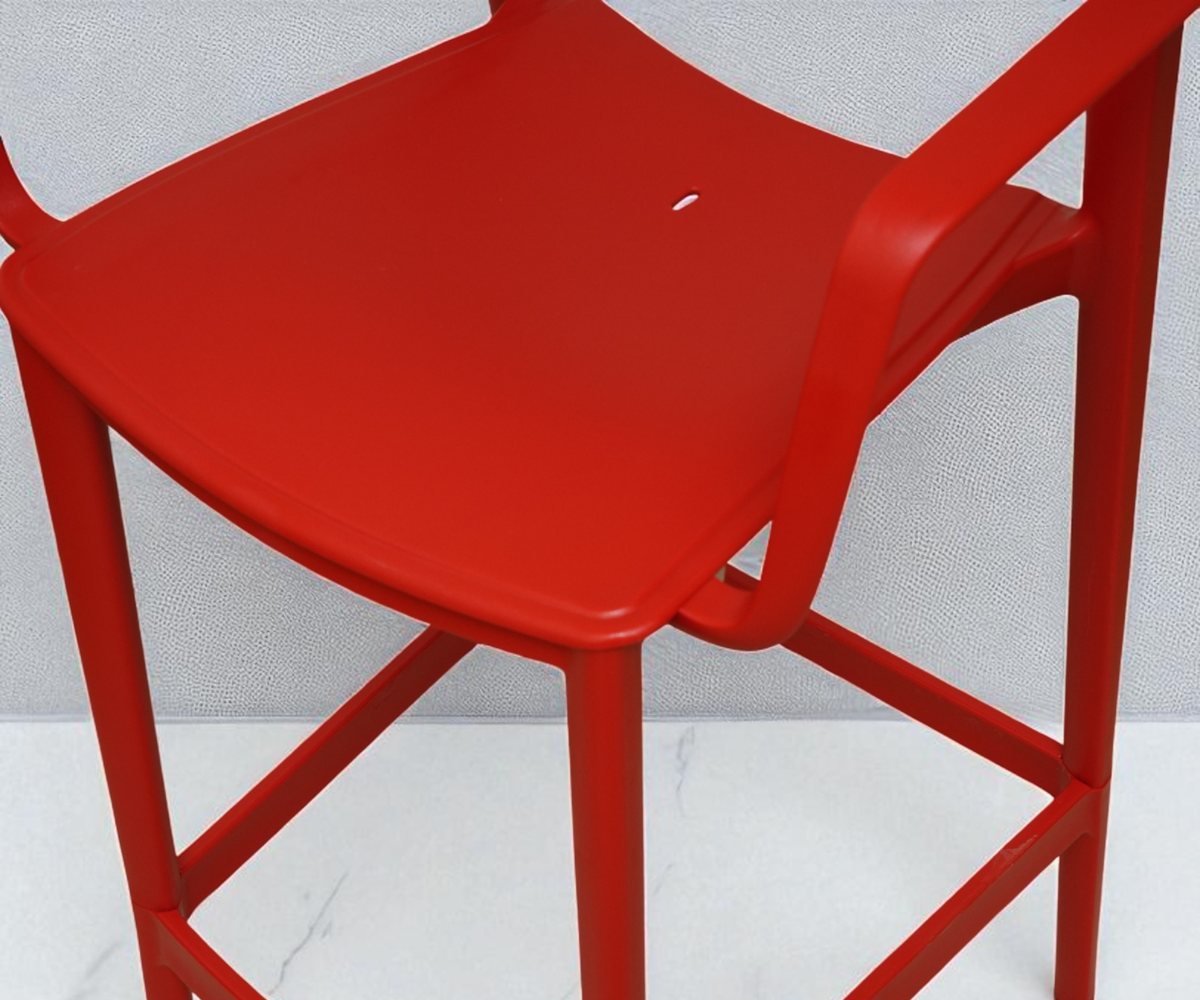 CT032-BC modern perforated bar stool in red, angled view with a footrest