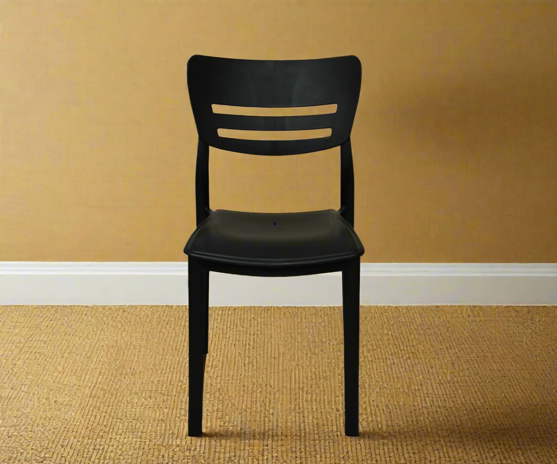 CT036 YAPRAK chair black105, angled view against a cream wall