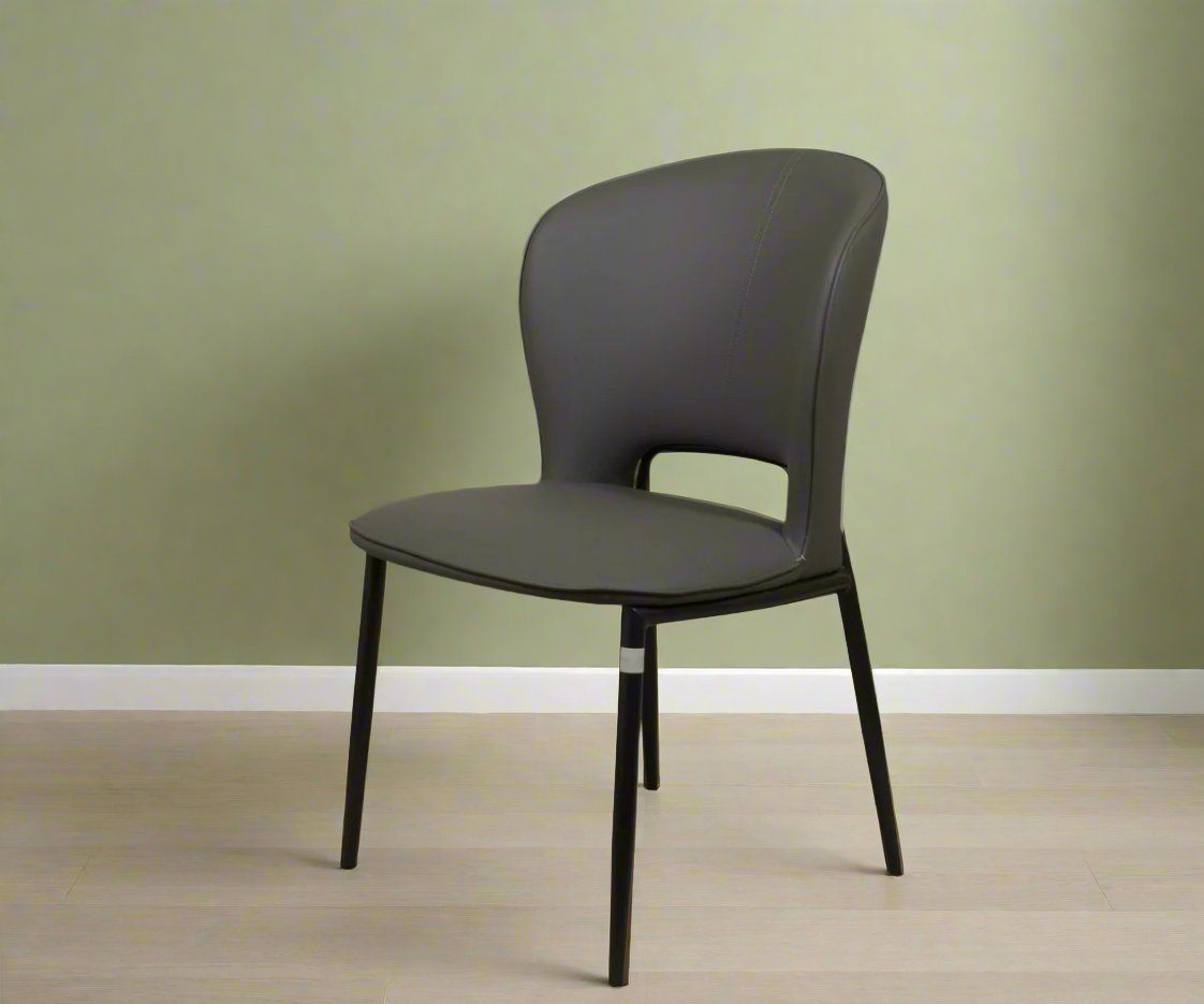 Dining chair 087 ash, angled view against a sage wall